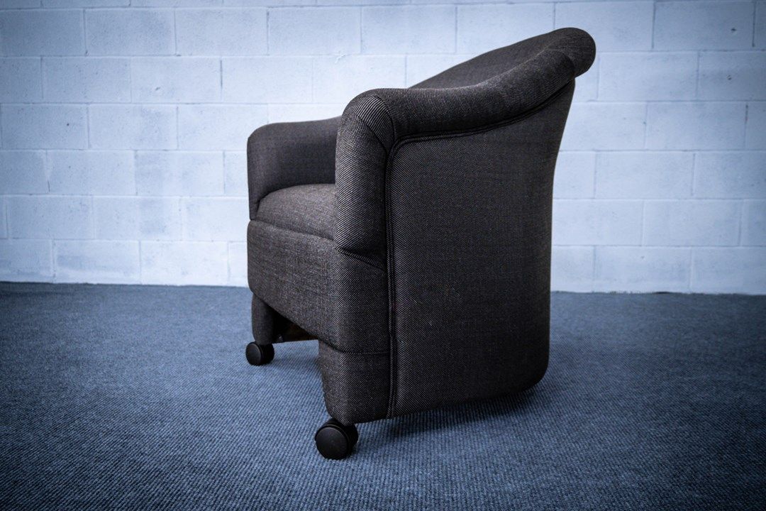 Barrel chair in gray fabric side view