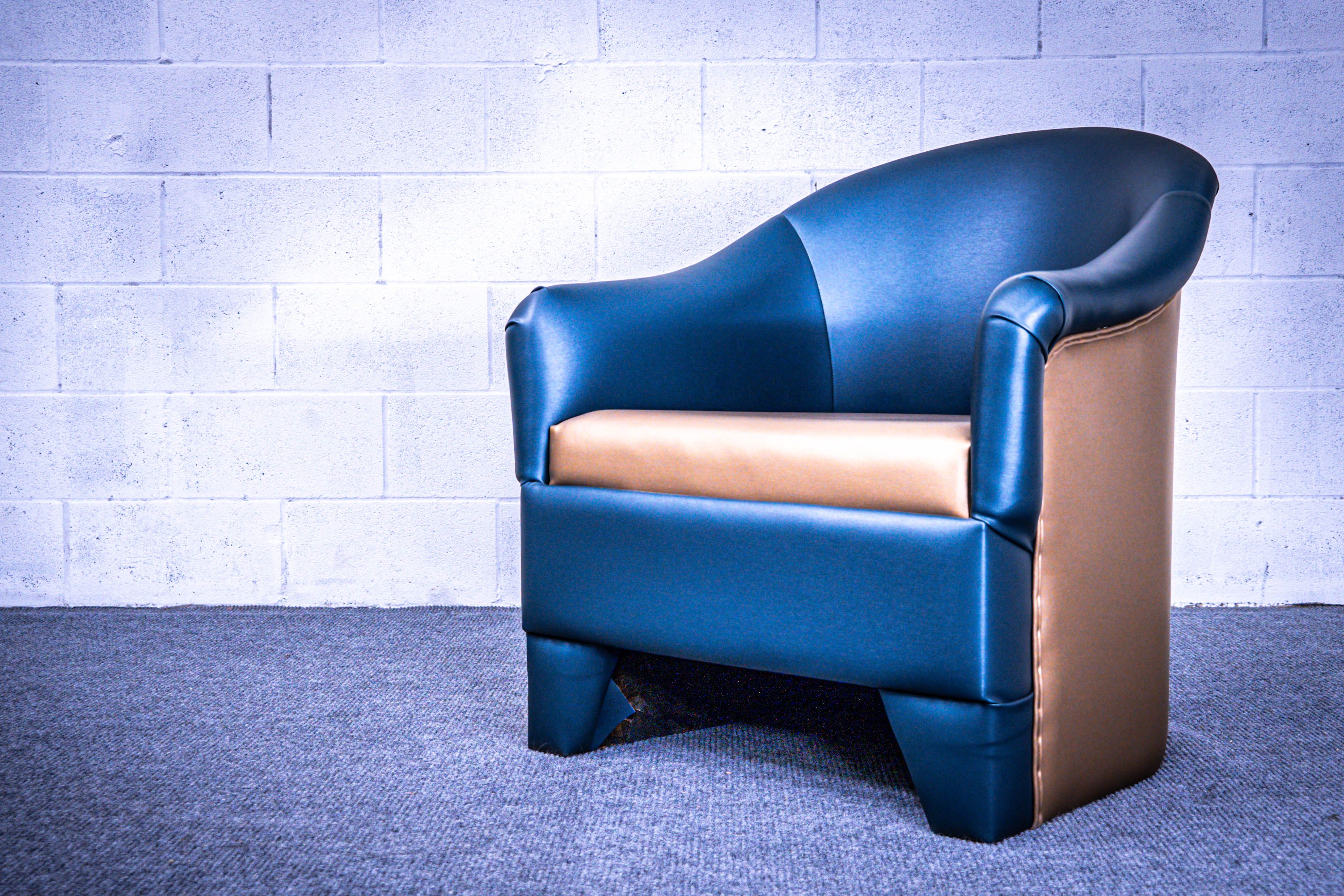 Blue and gold barrel chair